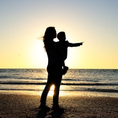 Happy Asian Mother (35-40 years old) holding her Half-Asian young son (3-4 years old boy) with love ...