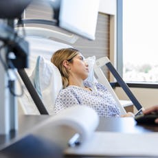 A woman looks upset in the doctor's office