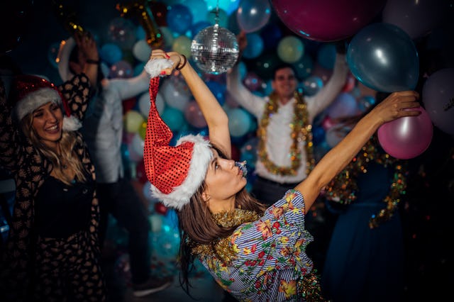 Group of friends having a new year party  and dancing