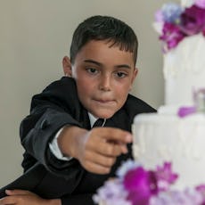 Child steals frosting from wedding cake. A Redditor just asked if they were in the wrong for publicl...