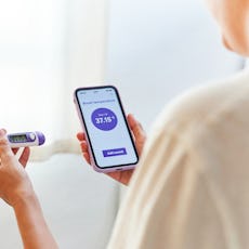 A woman tracks her basal body temperature, which is a good indicator for ovulation.