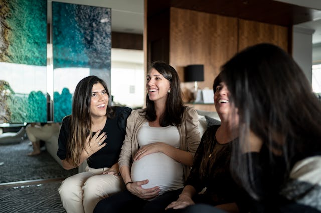 Mother enjoying moment with daughters at home