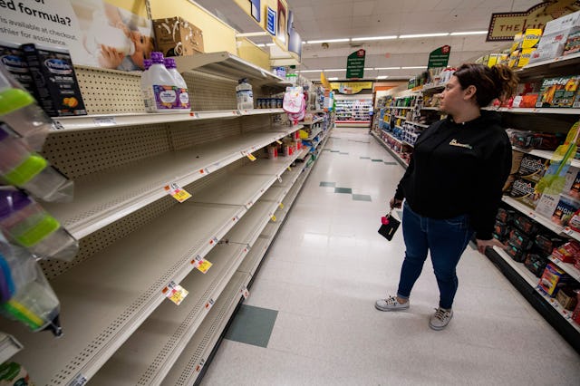 Shelves are empty as Natalia Restrepo, 29, a member of La Colaborativa, gathers formula supplies for...