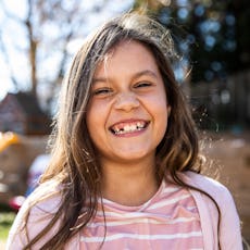 Portrait of young girl in backyard