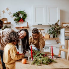 A mother talks to her children during a holiday dinner.