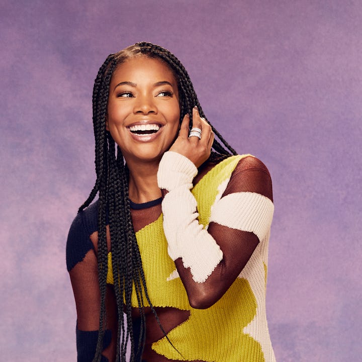 Actress and entrepreneur Gabrielle Union smiling in a tulle-knit combination dress in black, yellow ...