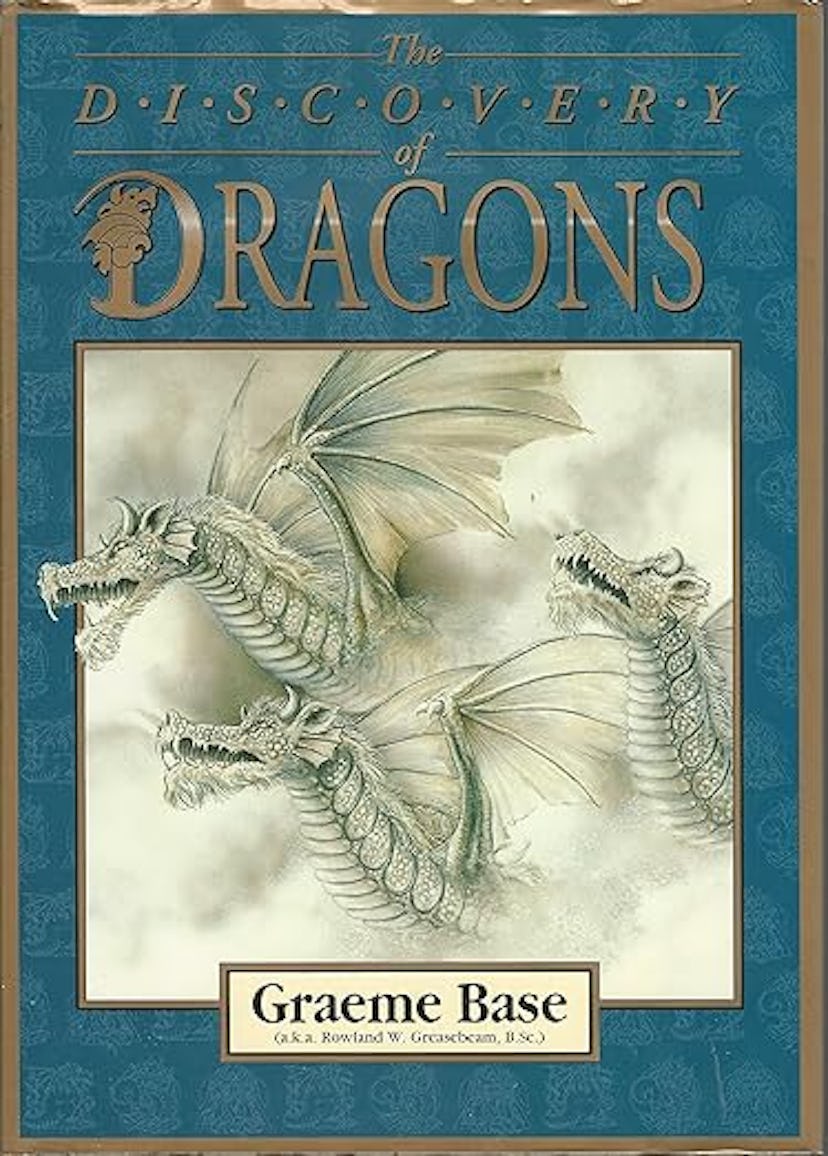 Book cover titled "The Discovery of Dragons" by Graeme Base, featuring an intricate illustration of ...