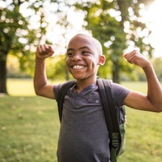 Little strong boy smiling 