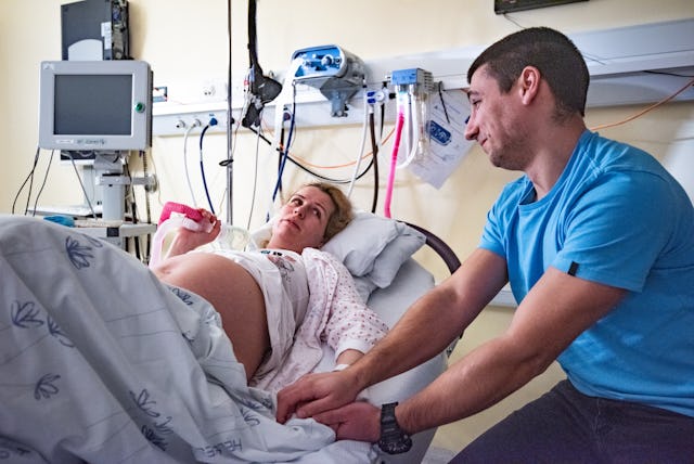 Man and pregnant women in delivery room. A mom posted a TikTok stating that she would want her husba...