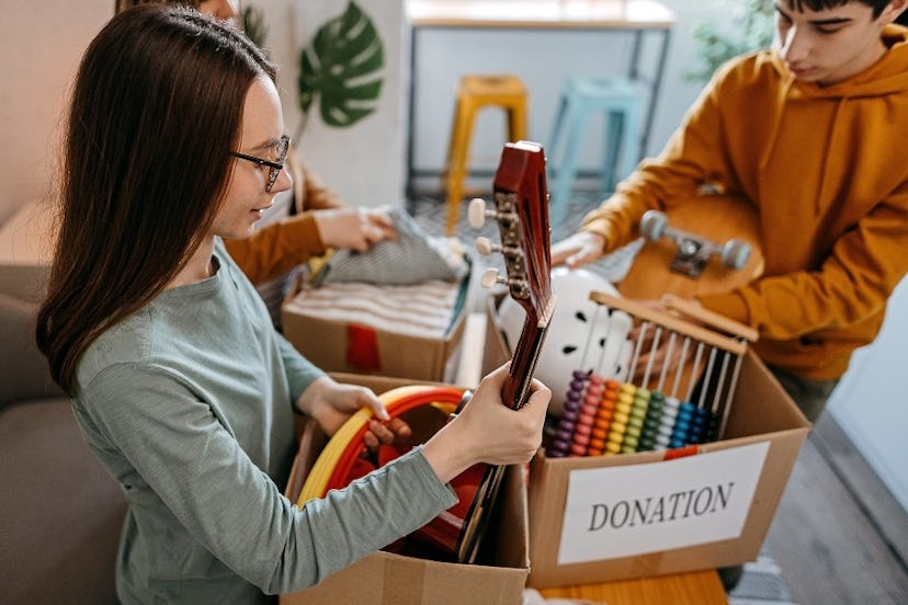 Teens sort through items to donate.