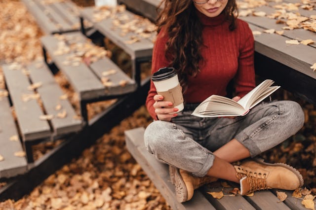 A woman reading a book surrounded by fallen leaves. Keep an eye out for these highly anticipated rel...