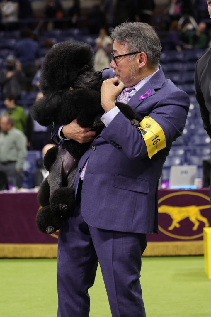 Dog handler Kaz Hosaka and Sage, Best in Show and Non-Sporting Group winner pose during the 148th An...