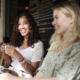 Women enjoy coffee in France.